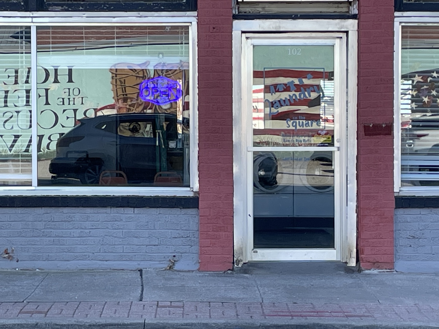 The front door of Laundry on the Square on East Walnut Street